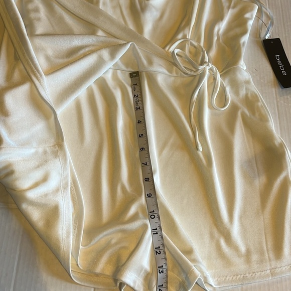 NWT-Bebe-XL-white-stretchy, adjustable straps, wrap skirt romper. Built in short - Picture 12 of 13